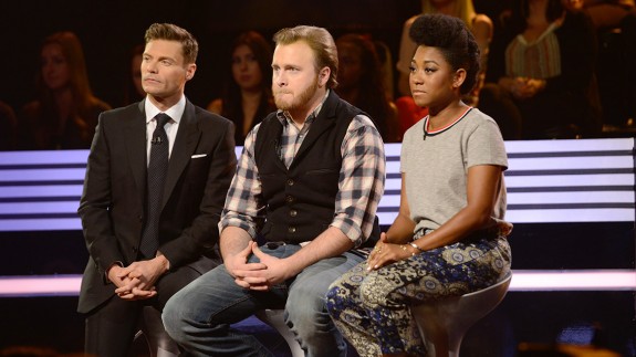 Ben and Majesty sit in the hot seats of the Bottom 3 next to Ryan Seacrest.