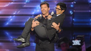 Harry Connick, Jr. cradles Munfarid Zaidi as Zaidi sings Connick's "Every Man Should Know."